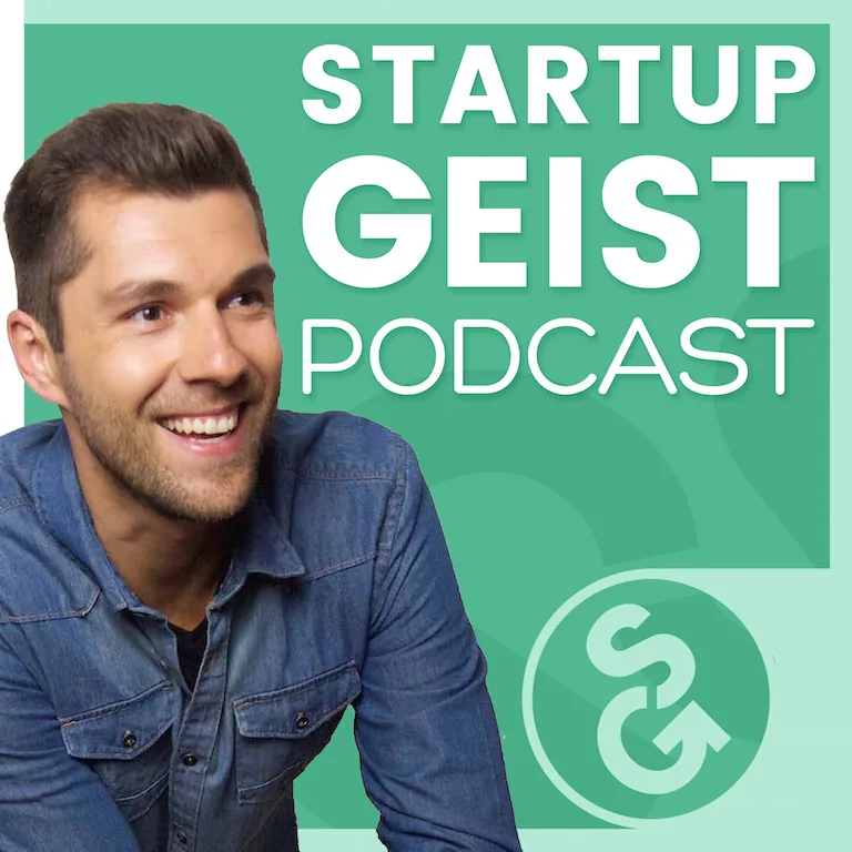 StartupGeist Podcast cover art: a smiling man in a denim shirt beside the show title and logo.