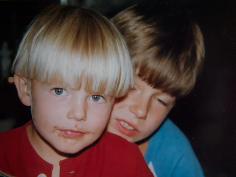Two boys, cheek to cheek, in a scanned family photo from Danny's East German childhood.
