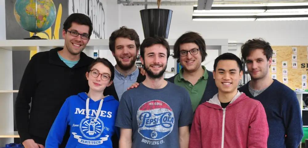 The Spotistic team crowded into one photo in the Berlin startup office, smiling.